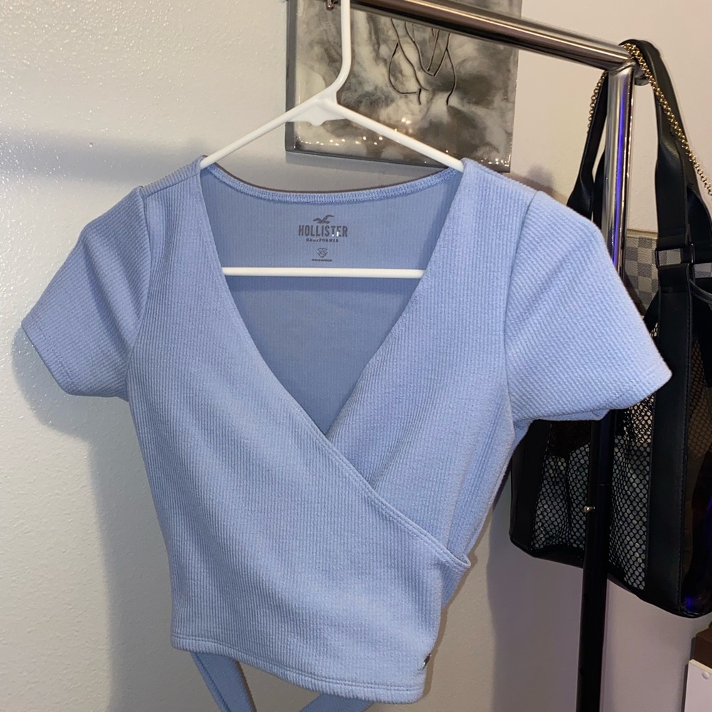 Blue crop top with tie in the back.
